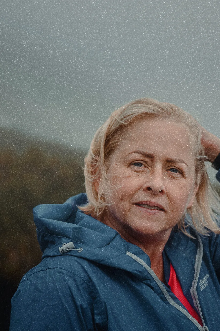 A portrait by the sea on an overcast day, developed in the AMBER look