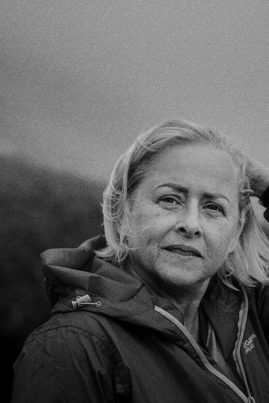 A portrait by the sea on an overcast day, developed in the FINE MONO look